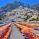 The coastal shores of Positano’s Spiaggia beach with umbrellas and chairs